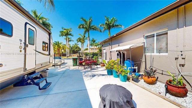 view of patio / terrace featuring grilling area and fence