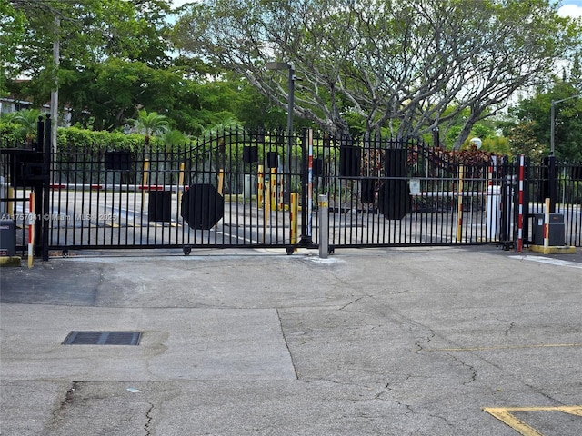 view of gate with fence