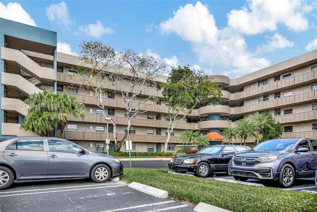 view of property featuring uncovered parking