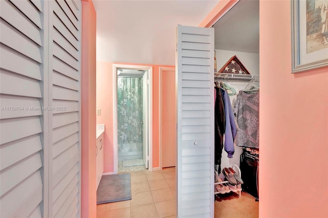 doorway to outside with light tile patterned flooring