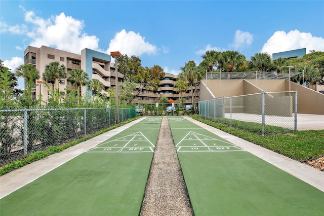 view of community featuring fence