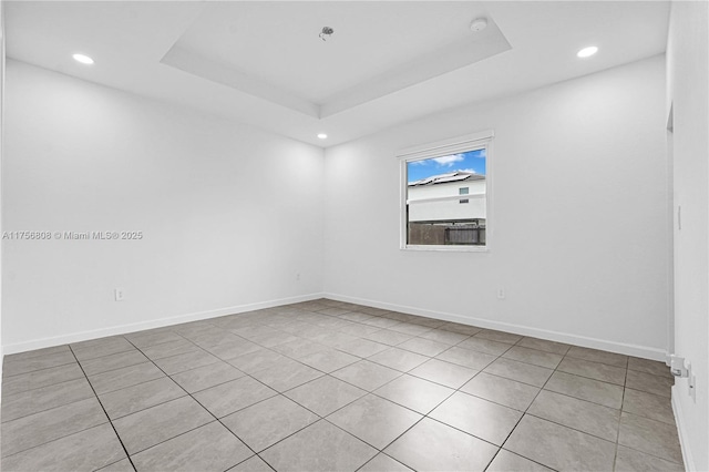 12735 SW 211th St, Miami, FL 33177 - unfurnished room with light tile patterned flooring, recessed lighting, baseboards, and a tray ceiling