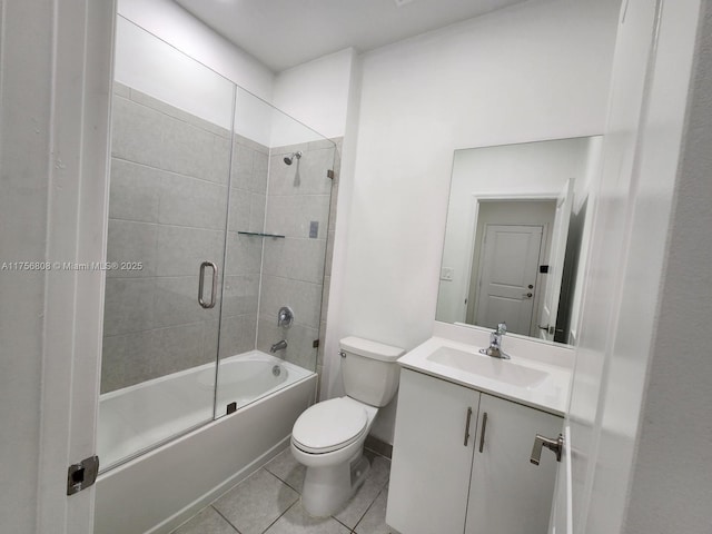 bathroom with vanity, bathtub / shower combination, toilet, and tile patterned floors