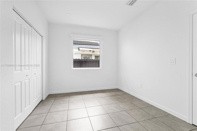 12735 SW 211th St, Miami, FL 33177 - unfurnished bedroom with light tile patterned floors, a closet, and baseboards