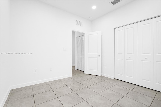 12735 SW 211th St, Miami, FL 33177 - unfurnished bedroom featuring light tile patterned flooring, baseboards, a closet, and recessed lighting