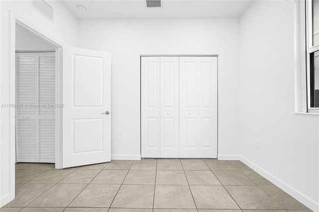 12735 SW 211th St, Miami, FL 33177 - unfurnished bedroom featuring light tile patterned flooring and baseboards