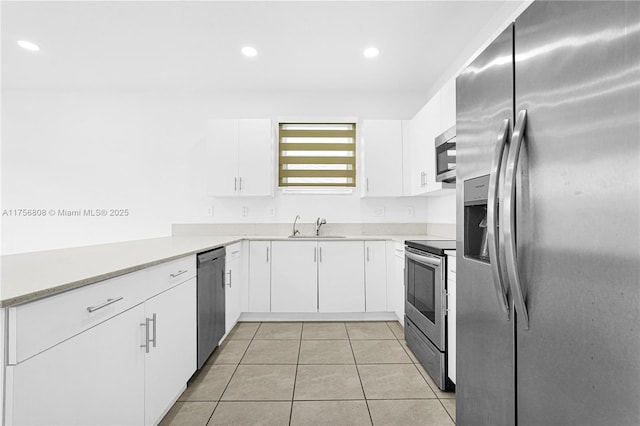 12735 SW 211th St, Miami, FL 33177 - kitchen with appliances with stainless steel finishes, a sink, white cabinetry, light countertops, and light tile patterned floors