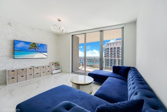 living area featuring marble finish floor and floor to ceiling windows