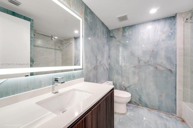 bathroom featuring marble finish floor, visible vents, tile walls, and an enclosed shower