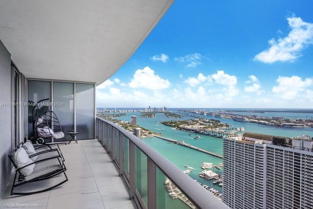 balcony featuring a water view