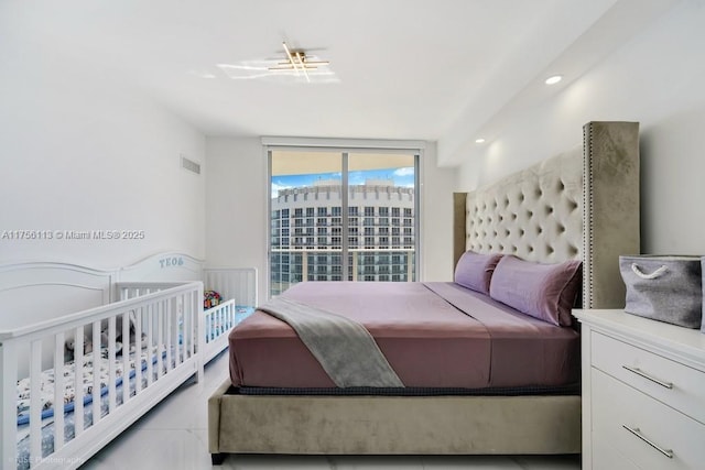 bedroom featuring visible vents and recessed lighting