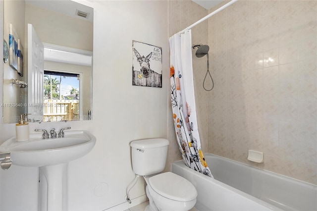 full bathroom featuring toilet, shower / bath combination with curtain, and visible vents