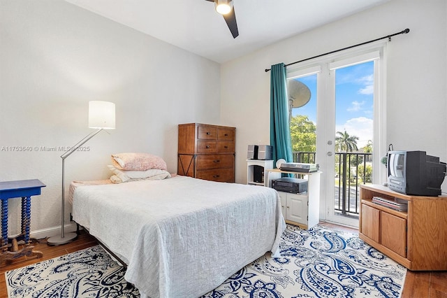 bedroom with a ceiling fan, access to outside, light wood-style flooring, and baseboards