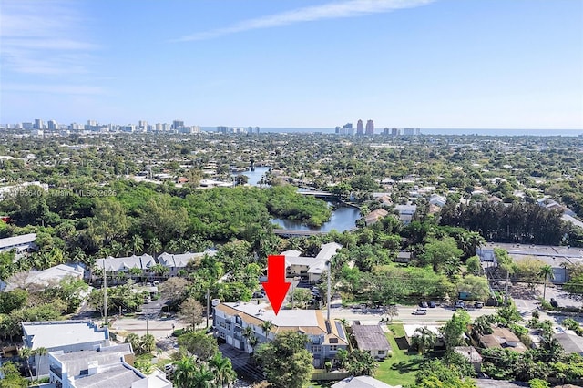 drone / aerial view featuring a water view and a city view