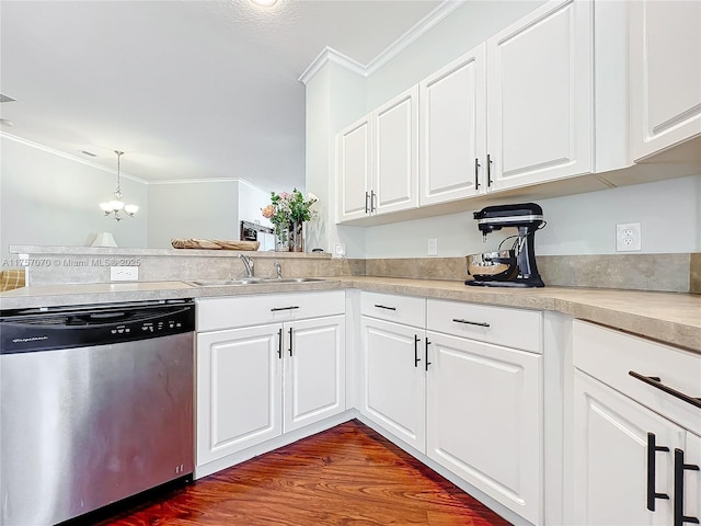 kitchen featuring ornamental molding, light countertops, dishwasher, and a sink