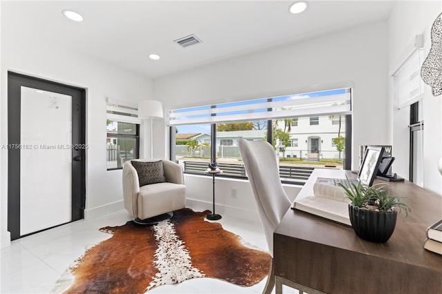 office area featuring visible vents, baseboards, recessed lighting, and plenty of natural light