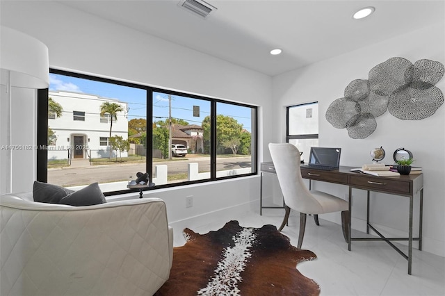 office featuring recessed lighting, visible vents, baseboards, and tile patterned flooring