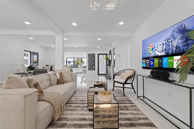 living room featuring recessed lighting and beamed ceiling