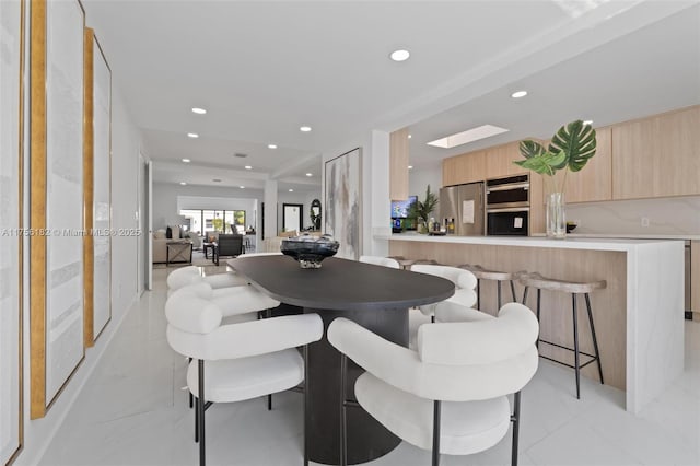 dining room with recessed lighting