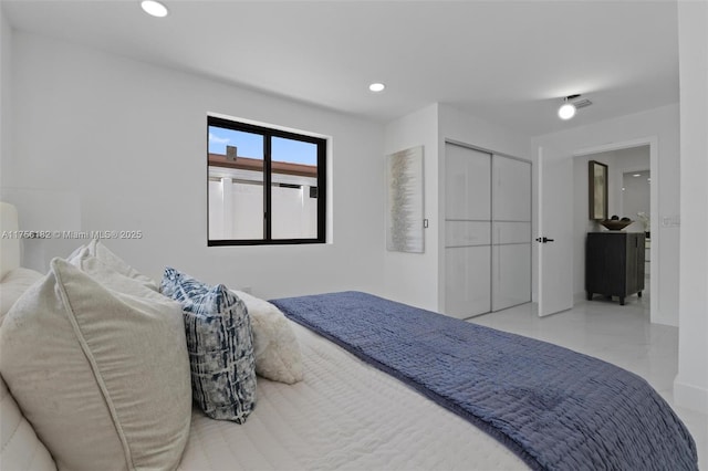 bedroom with visible vents and recessed lighting