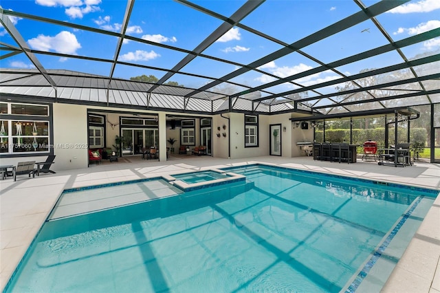 view of pool with a lanai, a pool with connected hot tub, outdoor dry bar, and a patio