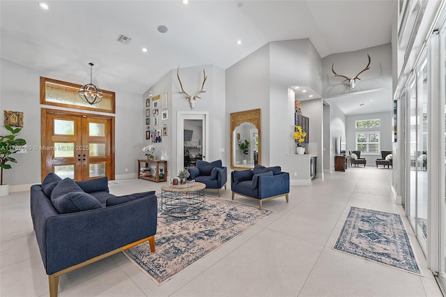 living room featuring high vaulted ceiling, french doors, visible vents, and light tile patterned floors