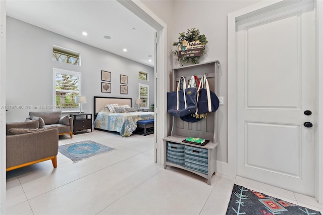 bedroom featuring light tile patterned floors and recessed lighting