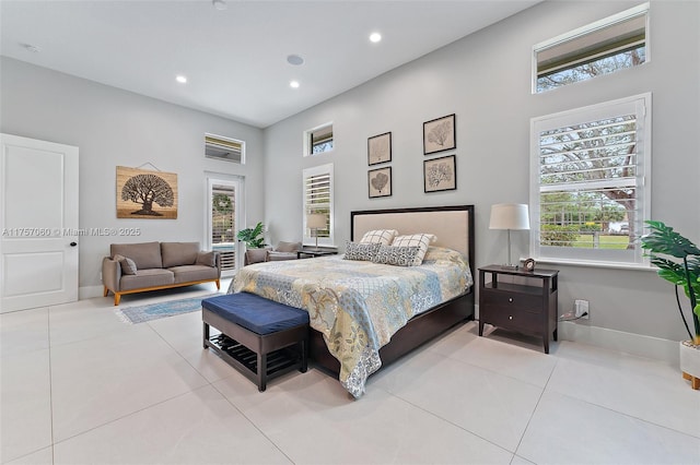 tiled bedroom featuring recessed lighting, multiple windows, and baseboards