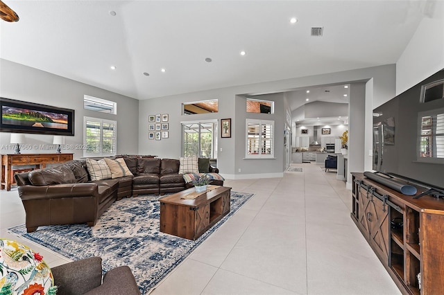 living room with light tile patterned floors, baseboards, and recessed lighting