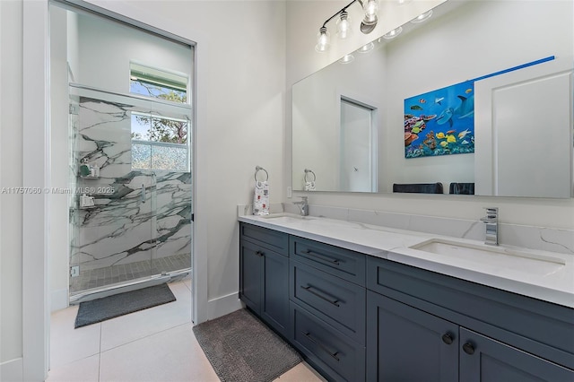 bathroom featuring double vanity, tile patterned flooring, a sink, and a marble finish shower