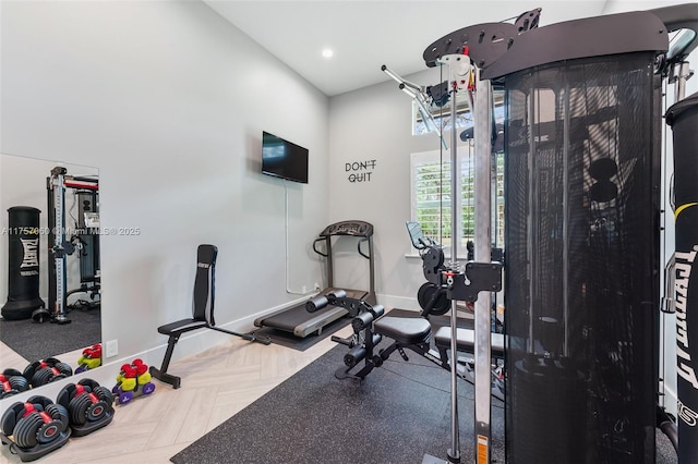 exercise area featuring recessed lighting and baseboards