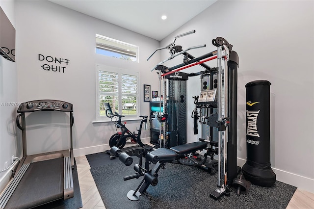 exercise area with recessed lighting and baseboards