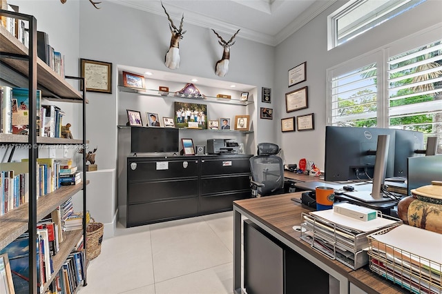 office area featuring light tile patterned floors and crown molding