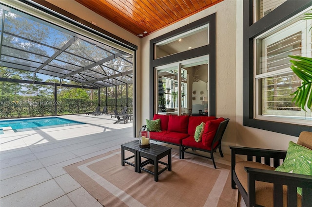 view of swimming pool featuring a lanai, a patio area, an outdoor hangout area, and a fenced in pool