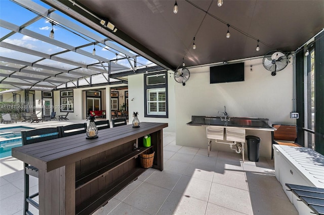 view of patio with a lanai and an outdoor pool