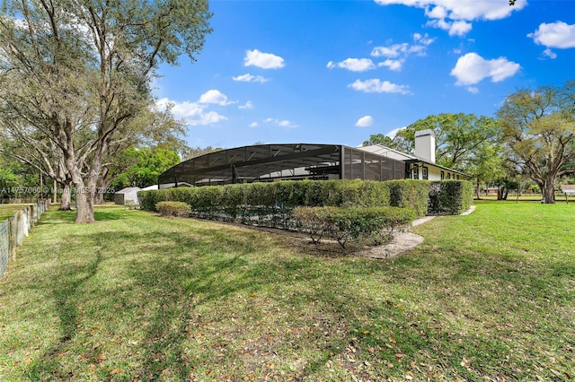 view of yard featuring a lanai