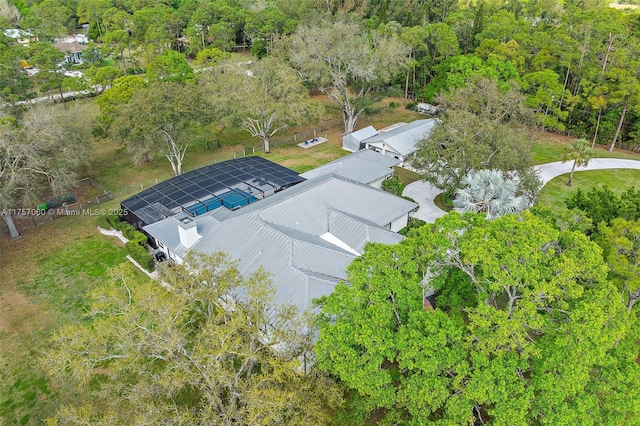 aerial view featuring a wooded view