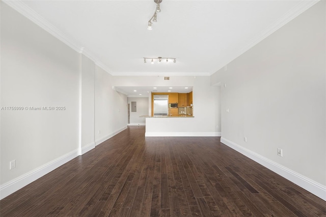 unfurnished living room featuring dark wood-style floors, baseboards, ornamental molding, and track lighting