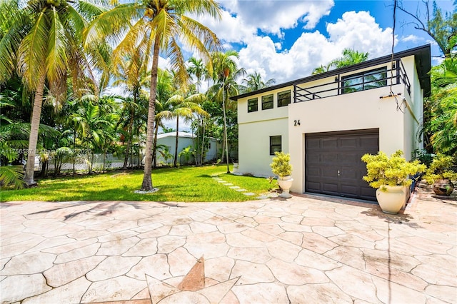 exterior space with concrete driveway and fence