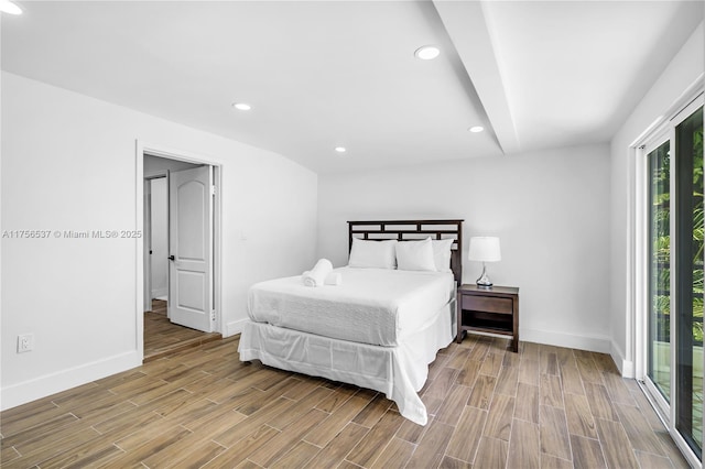 bedroom with wood tiled floor, baseboards, and recessed lighting