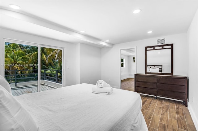 bedroom featuring access to exterior, recessed lighting, visible vents, wood finished floors, and baseboards