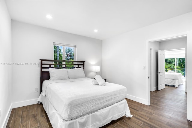 bedroom with dark wood-style floors, baseboards, and recessed lighting