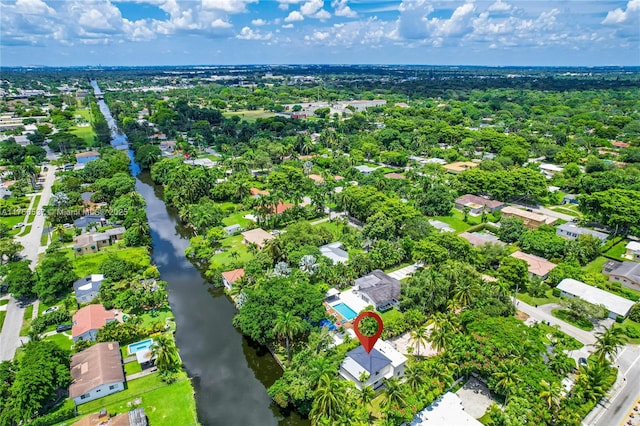 birds eye view of property with a water view and a residential view