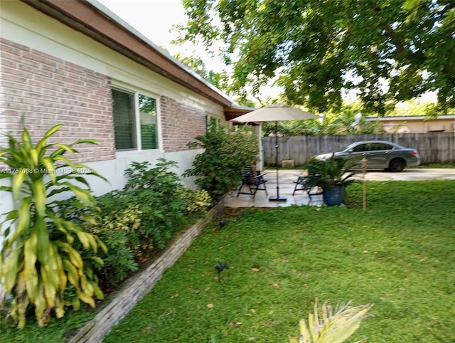 view of yard with a patio area and fence