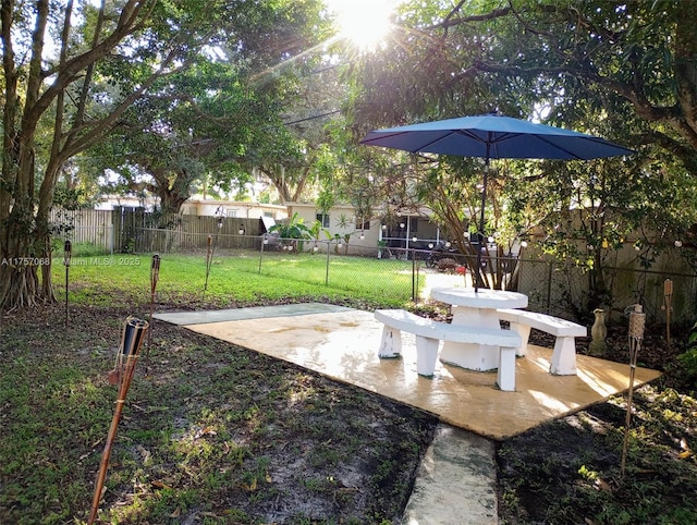 view of yard featuring a patio area and a fenced backyard