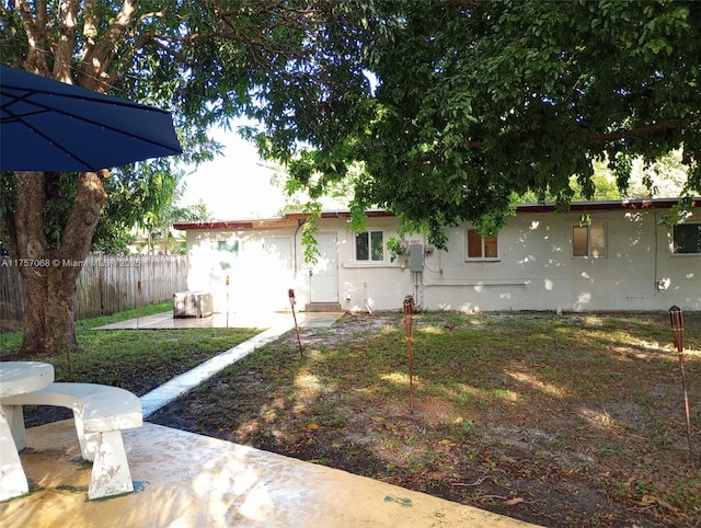 exterior space with fence and stucco siding