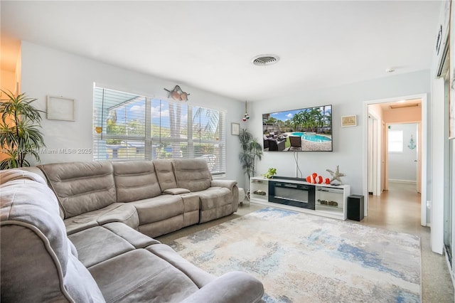 living room featuring visible vents