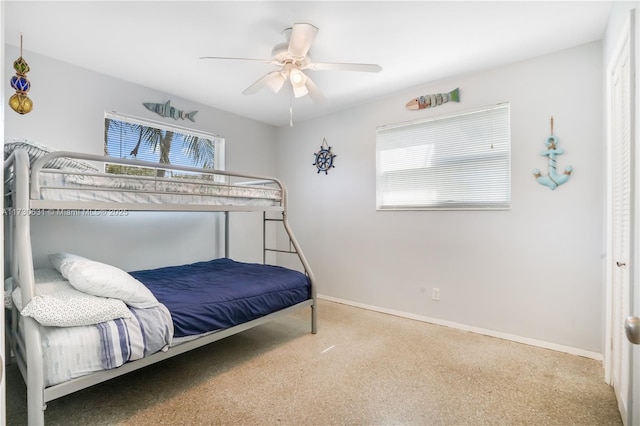 bedroom with baseboards, a ceiling fan, and speckled floor