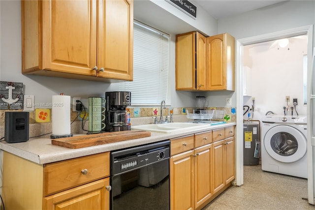 kitchen with black dishwasher, light countertops, a sink, and washer / dryer