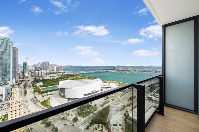 balcony with a view of city and a water view